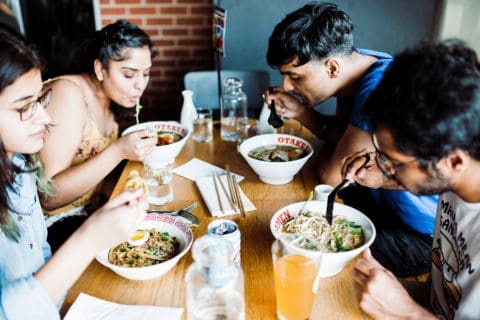 group of friends enjoying ramen