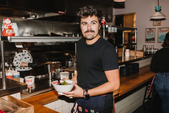 otaku ramen chef holding ramen bowl