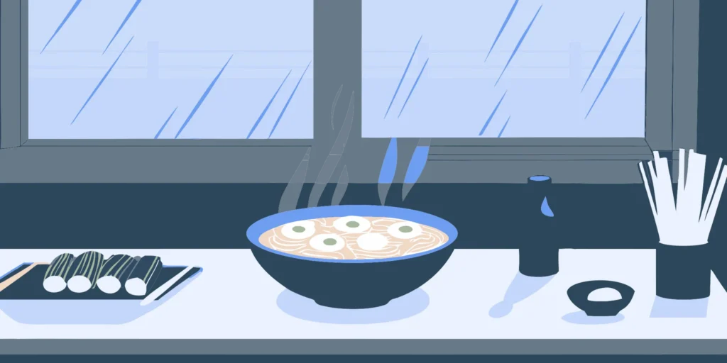 Steaming noodle bowl with chopsticks at a noodle bar.