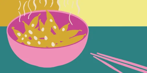 A bowl of steamed edamame pods ready to eat.